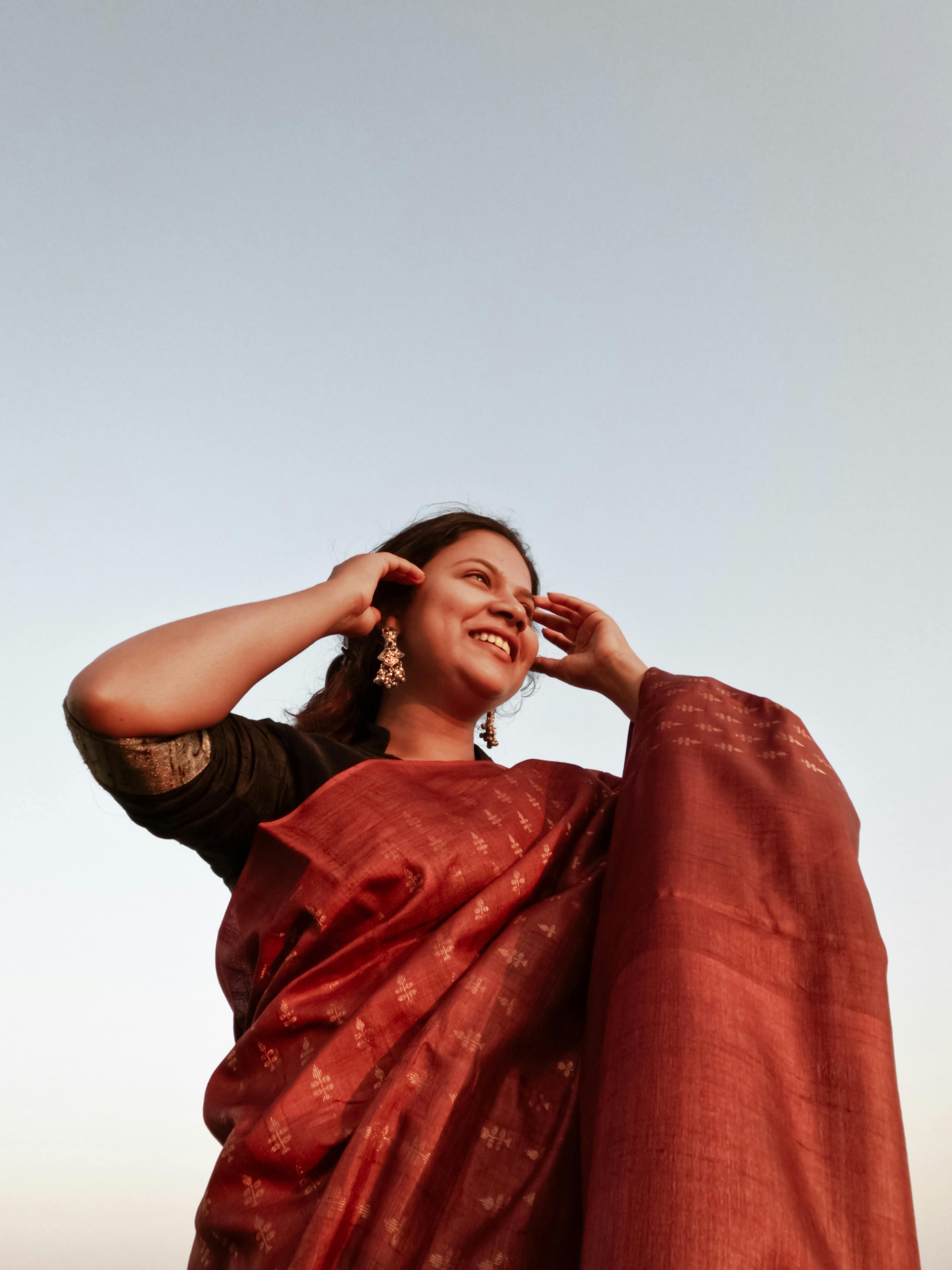 A Woman Wearing a Saree and Smiling · Free Stock Photo
