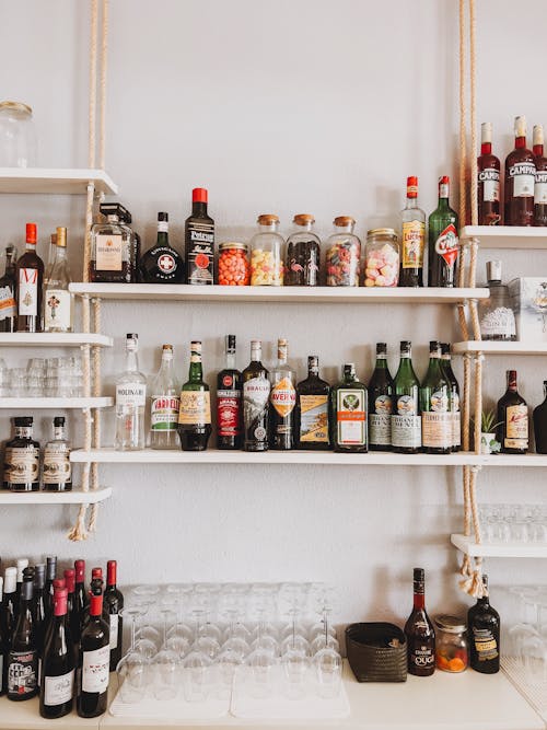 Bottles with Liquor on the Shelves in a Bar 