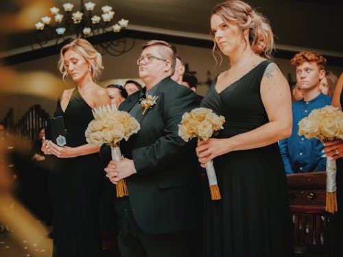 Women in Suit and Dresses in Church 