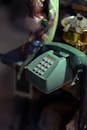 A Vintage Telephone and Figurines on the Table