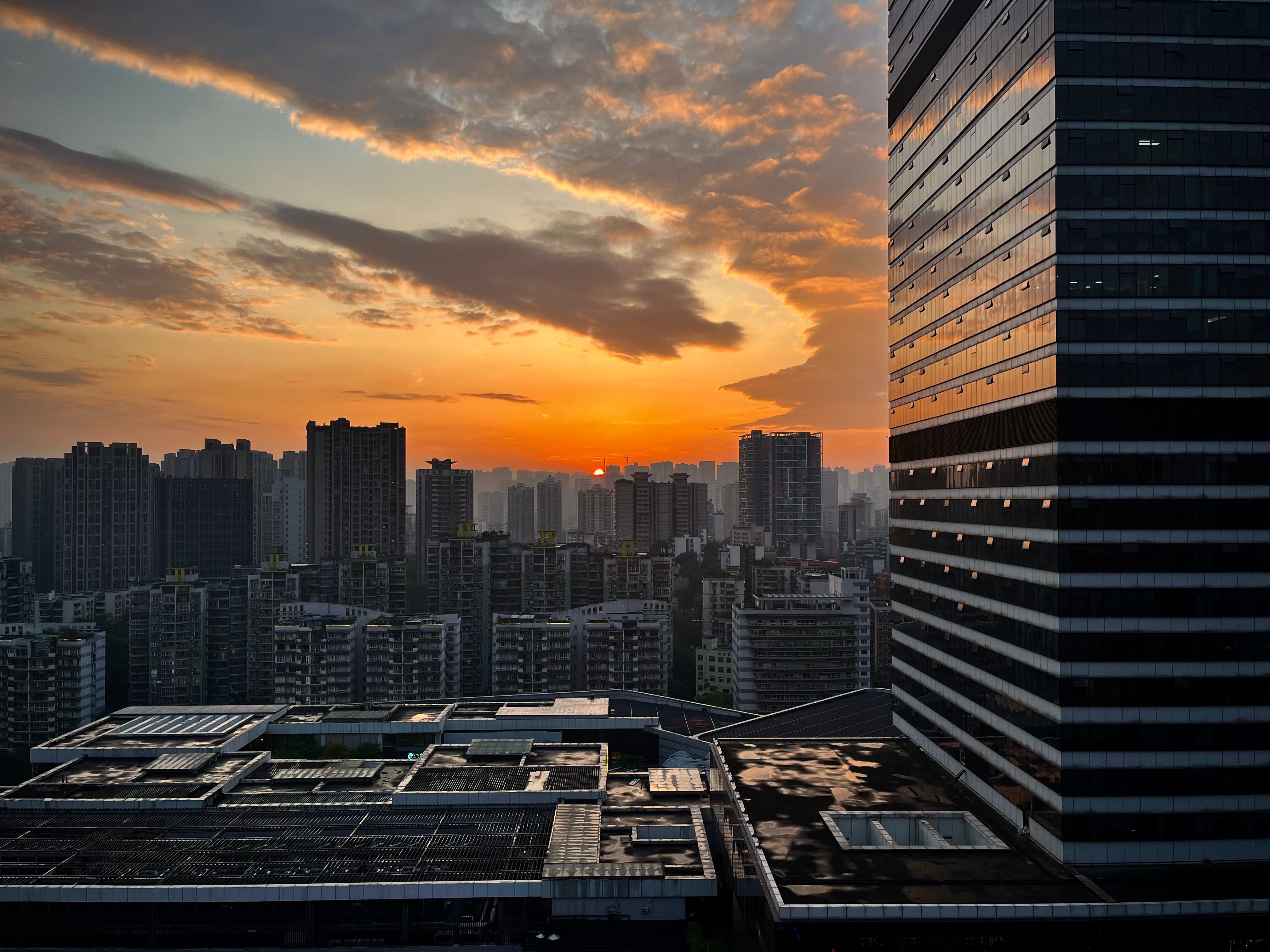 Sunset over Modern City Skyline · Free Stock Photo