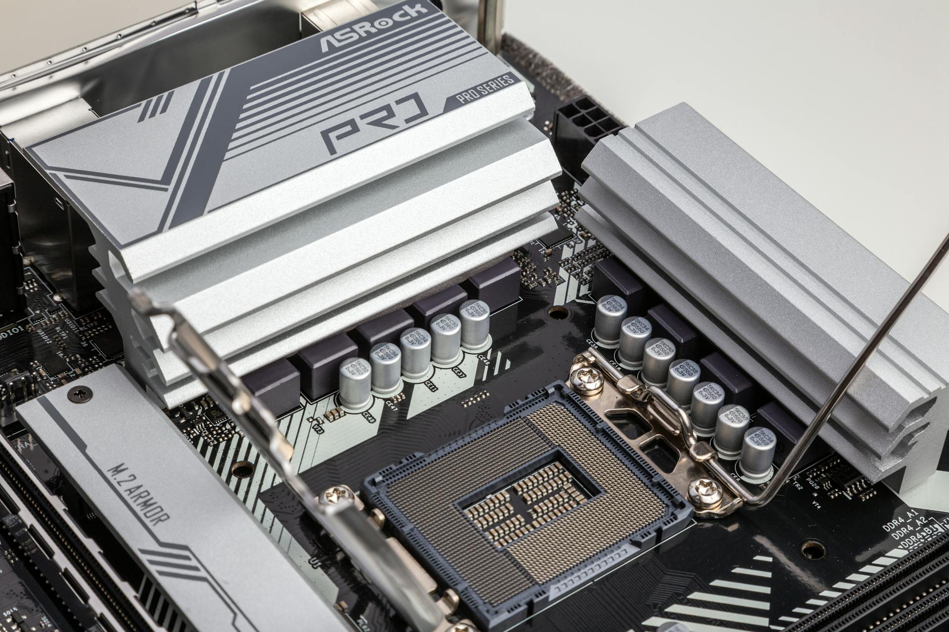 Detailed view of ASRock Pro Series motherboard showcasing CPU socket and heatsinks.