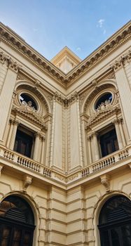 Corner view of a historic building facade with detailed architectural ornaments in São Paulo, Brazil.