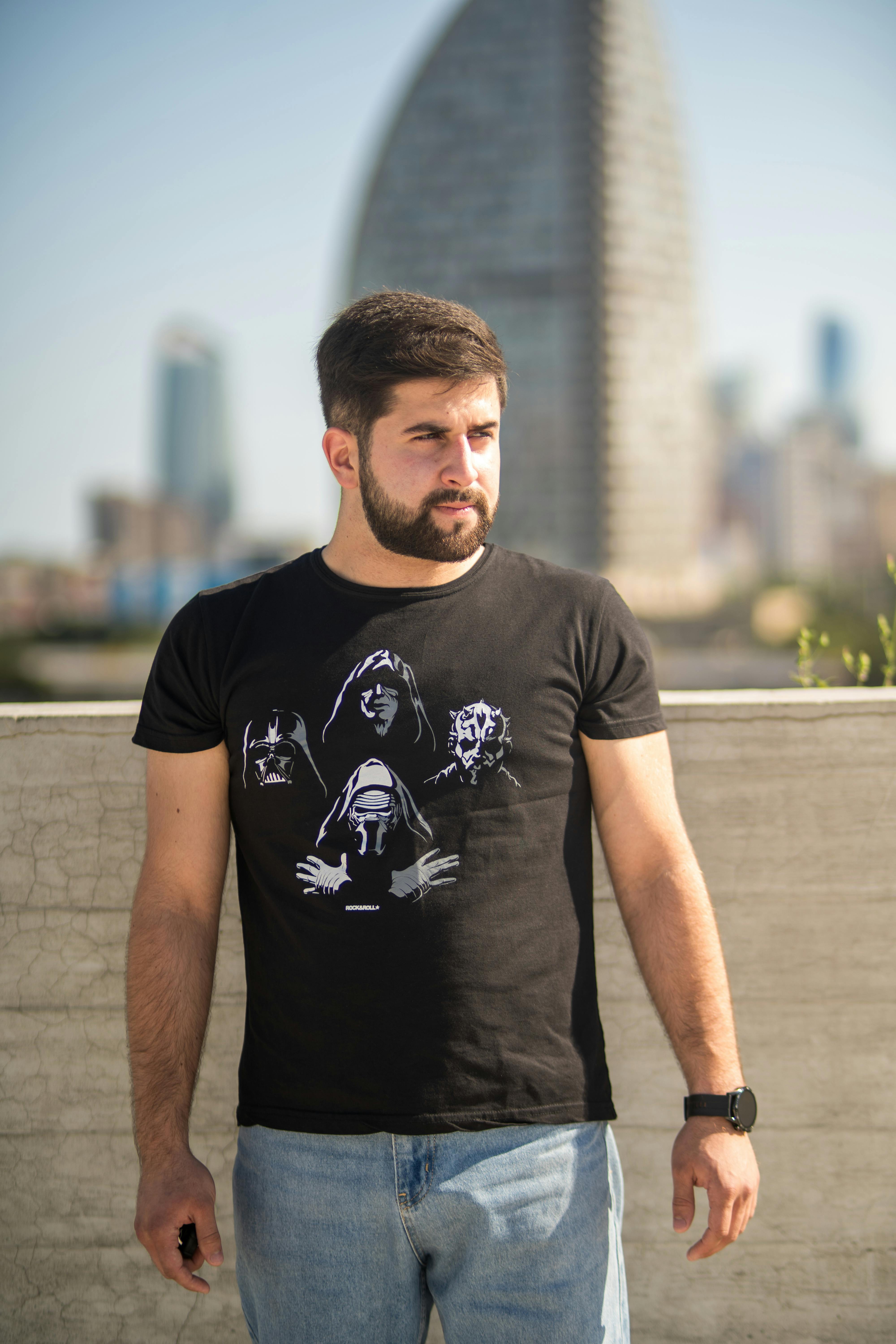 man in a t shirt with characters from star wars