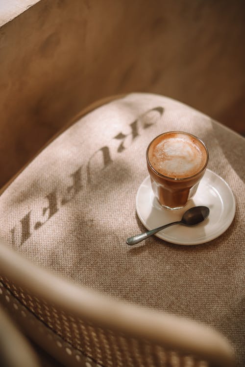 Free A Glass with Coffee Standing on a Chair  Stock Photo