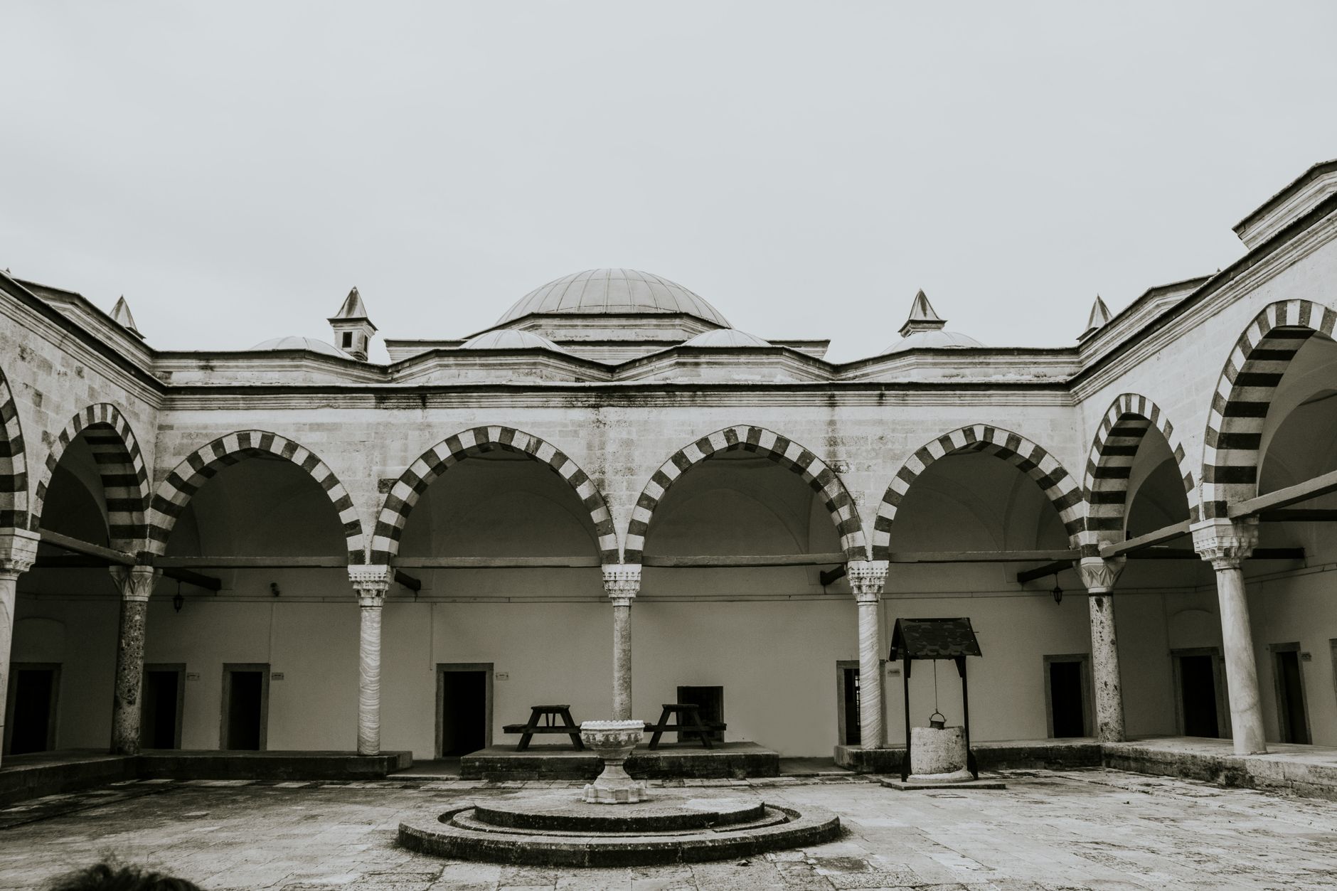 Serene view of the historic Beyazıt II Mosque courtyard in Edirne, Türkiye, showcasing Islamic architecture.