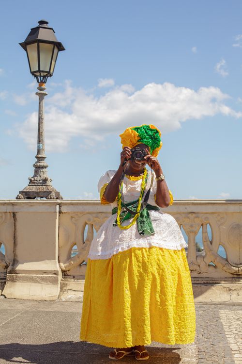 Woman in Traditional Clothing Taking Pictures with Camera Free Stock Photo Woman in Traditional Clothing Taking Pictures with Camera Free Stock Photo