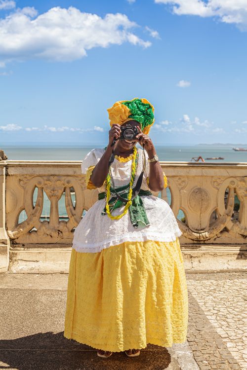 Woman in Traditional Dress Taking Photo Free Stock Photo Woman in Traditional Dress Taking Photo Free Stock Photo
