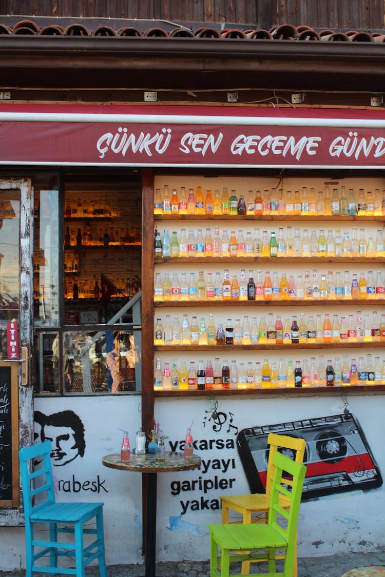 A Small Shop With Drinks On The Street 