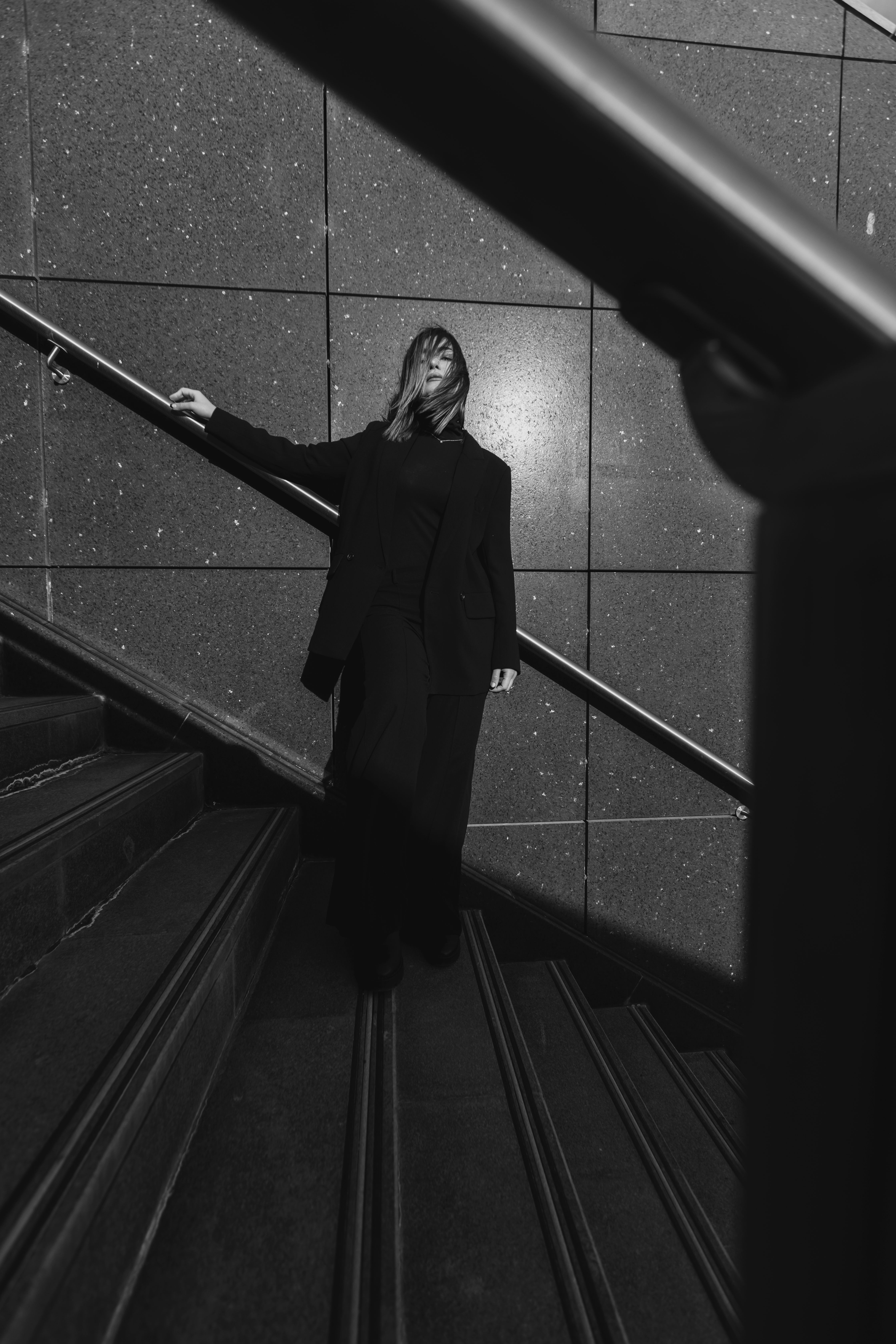 A woman in black standing on the stairs · Free Stock Photo