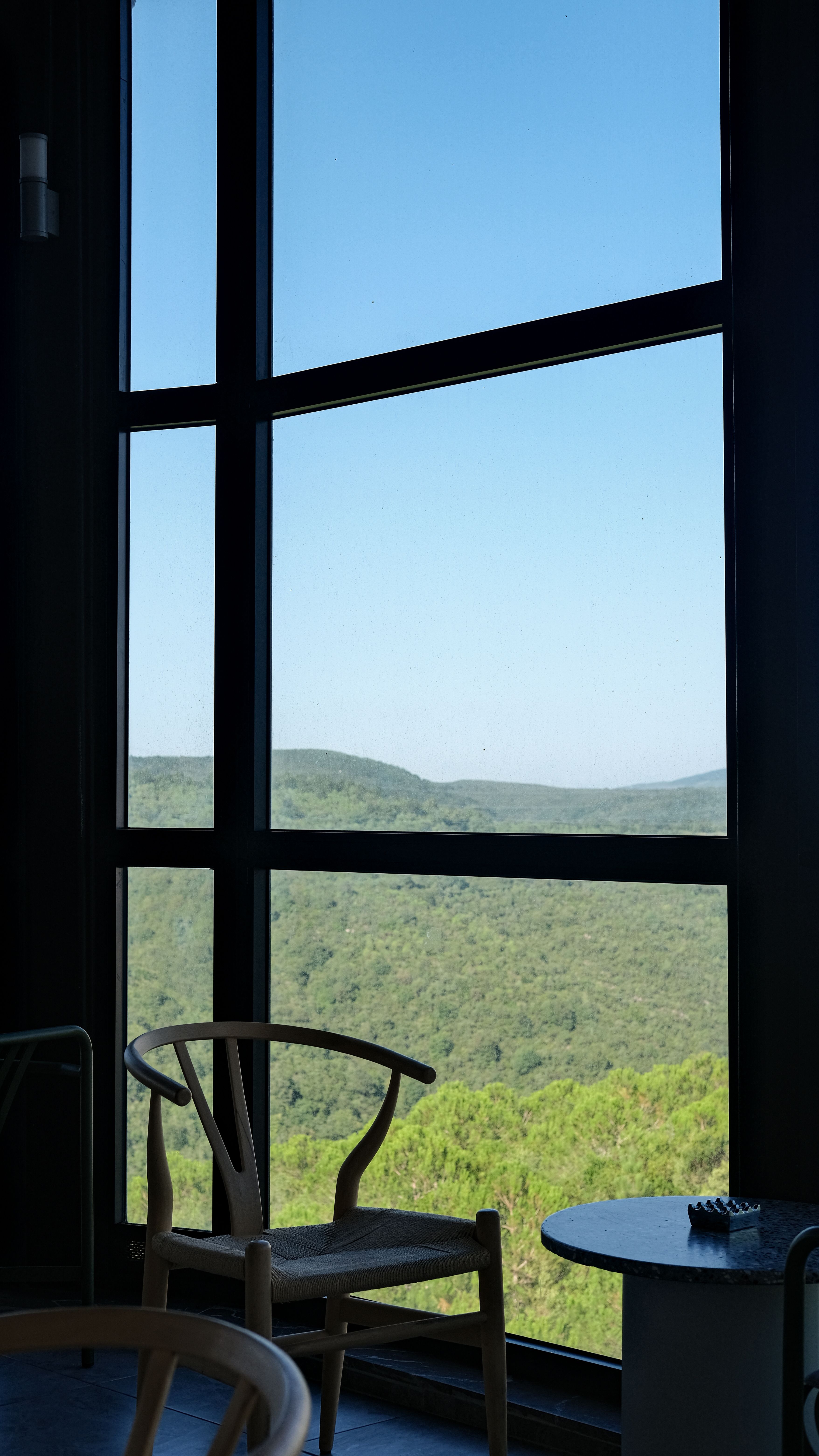 Chair and Table by Window Overlooking Hills · Free Stock Photo