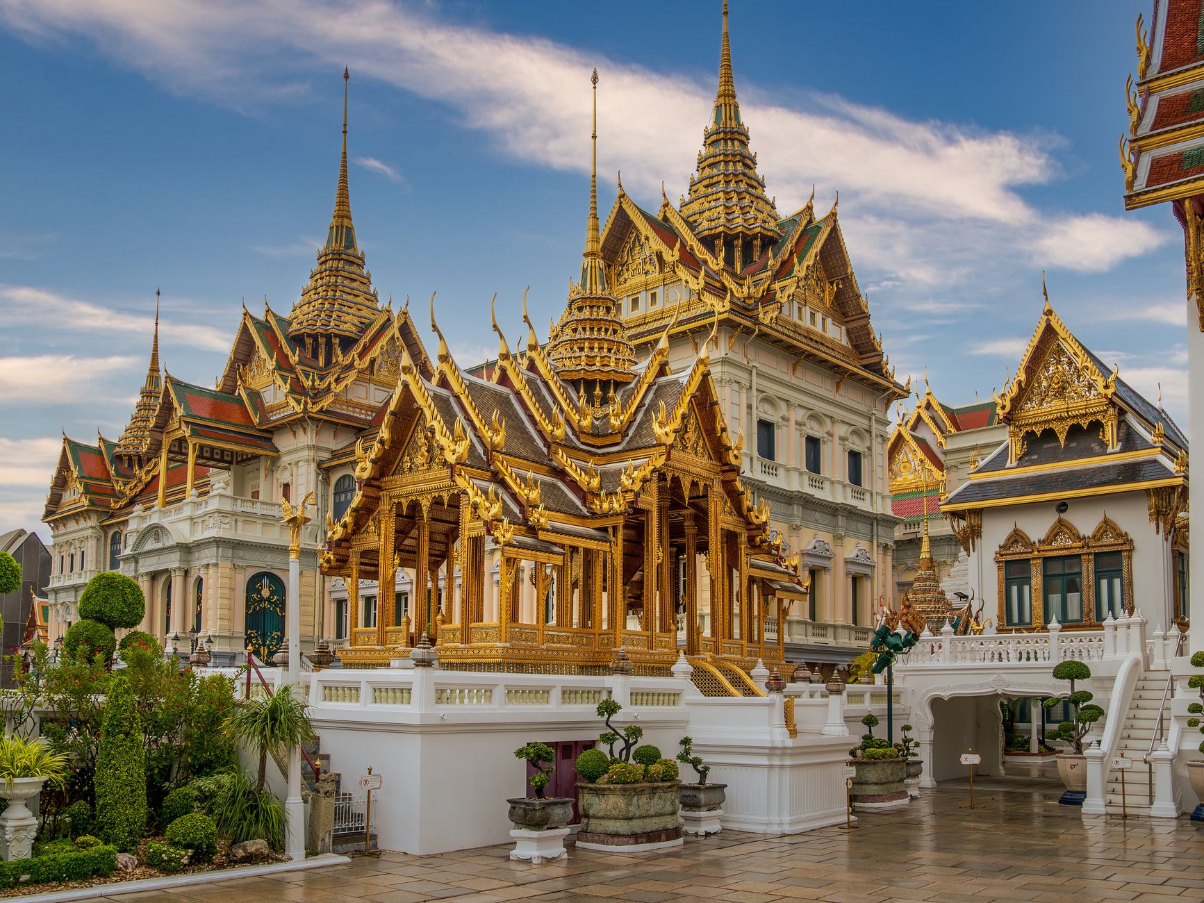 Captivating view of ornate golden temples at Bangkok's Grand Palace, Thailand.