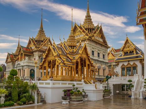 Captivating view of ornate golden temples at Bangkok's Grand Palace, Thailand.