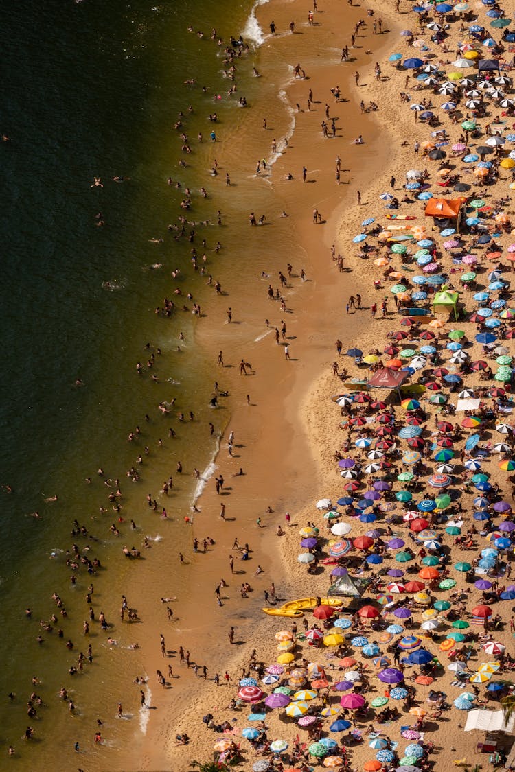 Crowd Of Tourists On Beach