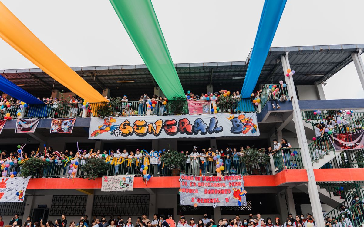 A lively school festival with colorful banners and balloons, showcasing excitement and community spirit.