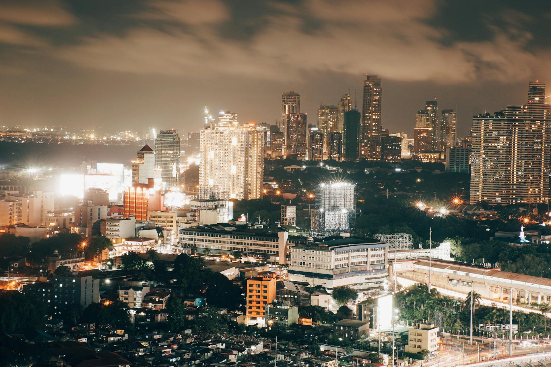 Stunning night view of Mumbai cityscape showcasing illuminated skyline and vibrant urban lights.