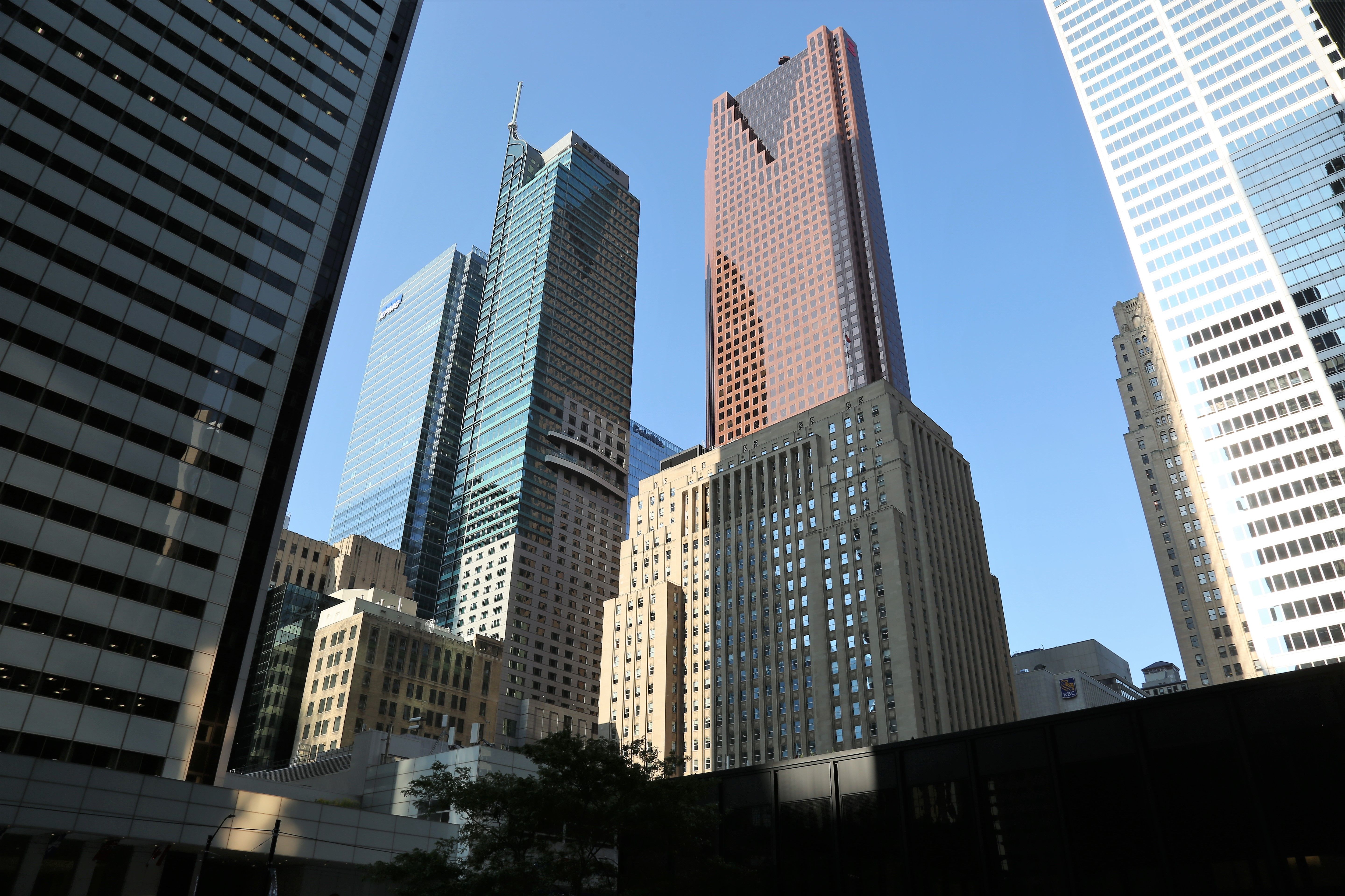 A downtown financial district skyline of office towers at dusk