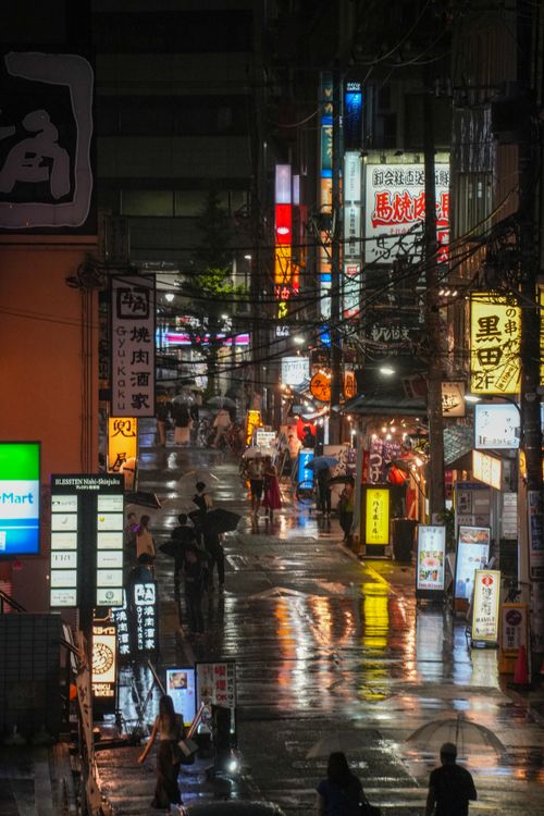 Bustling Tokyo Street Lined with Neon Signs · Free Stock Photo