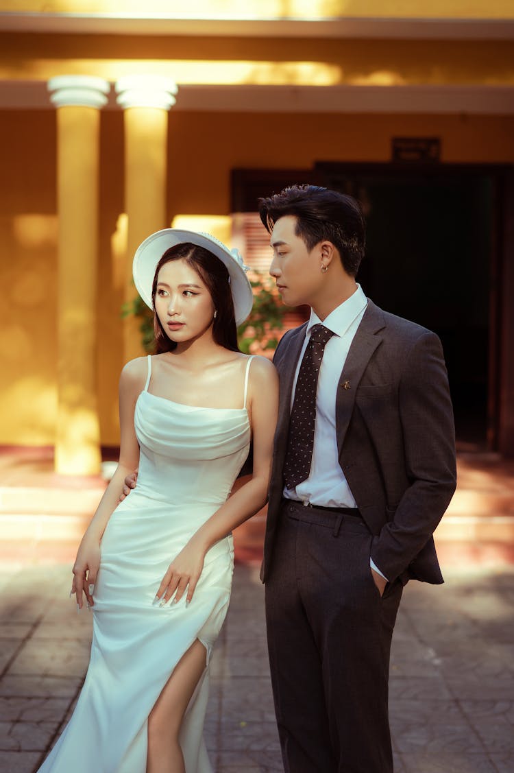 Elegant Dressed Couple Standing On Paving