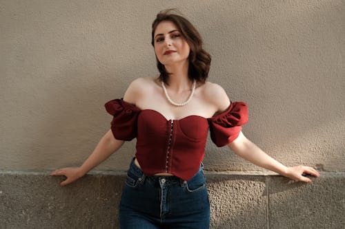 Woman in a Corset Top and Jeans 