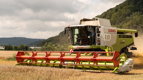 Combine Harvester Working in a Crop Field