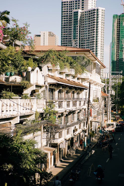 Free Street in Manila with Residential Buildings and Skyscrapers in Background Stock Photo