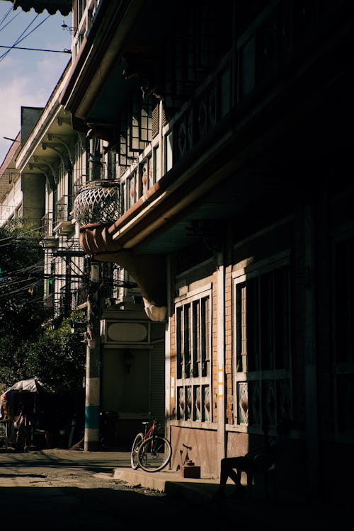 Bicycle Parked by a Traditional House on a City Street