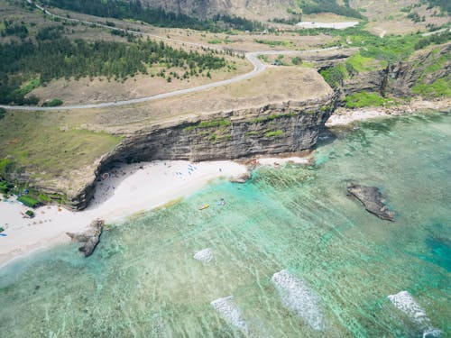 Aerial View of a Rocky Cliff on the Shore 