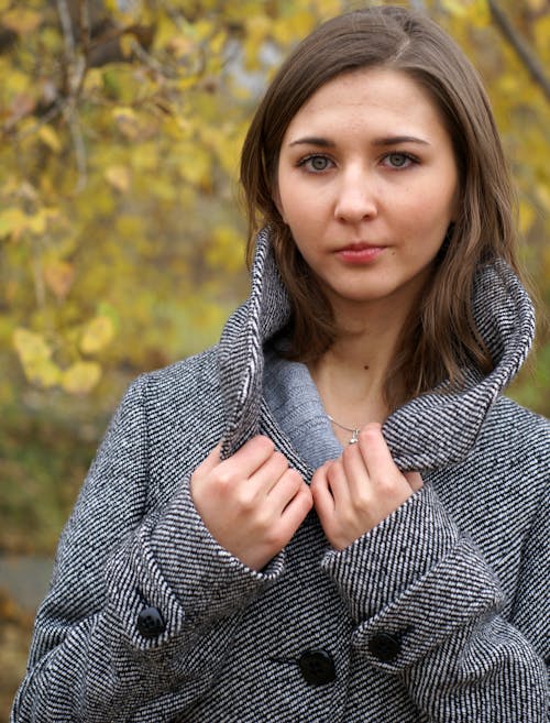 Young Woman Posing in a Grey Tweed Pea Coat