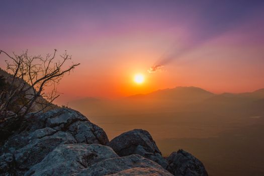 Majestic sunrise casting warm hues over the Aladağ mountains in Adana, Türkiye, creating a serene landscape.