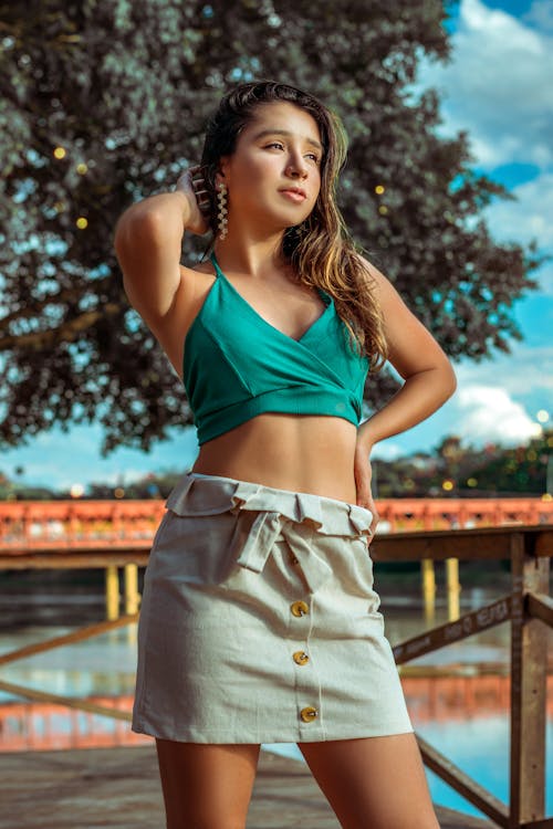 Woman in Blue Top and Skirt Posing