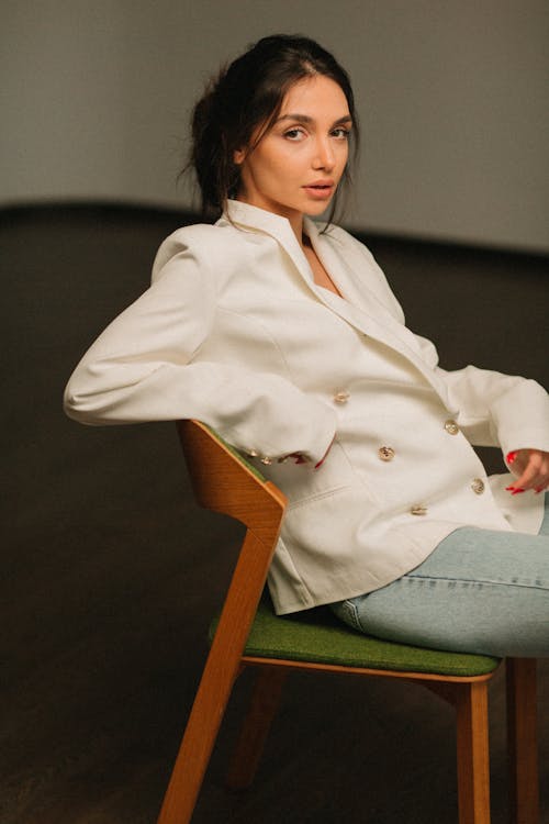 Brunette Woman Posing in a White Double-Breasted Blazer 