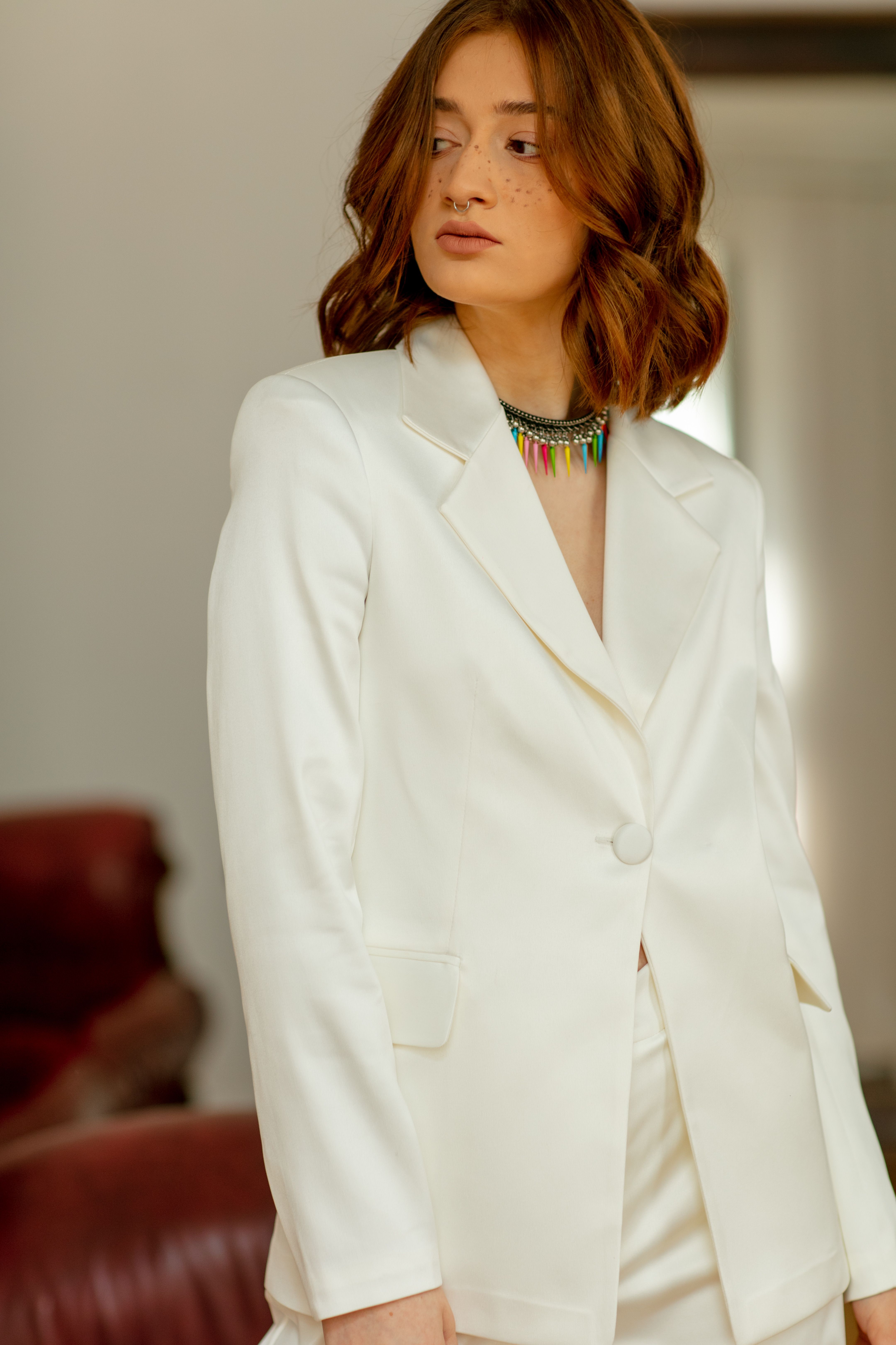 Standing Woman in White Suit · Free Stock Photo