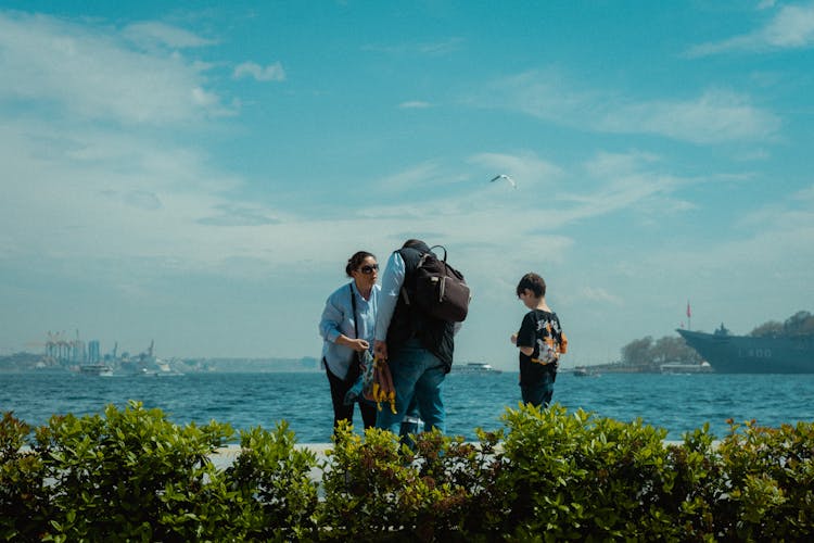 Family Standing On Promenade