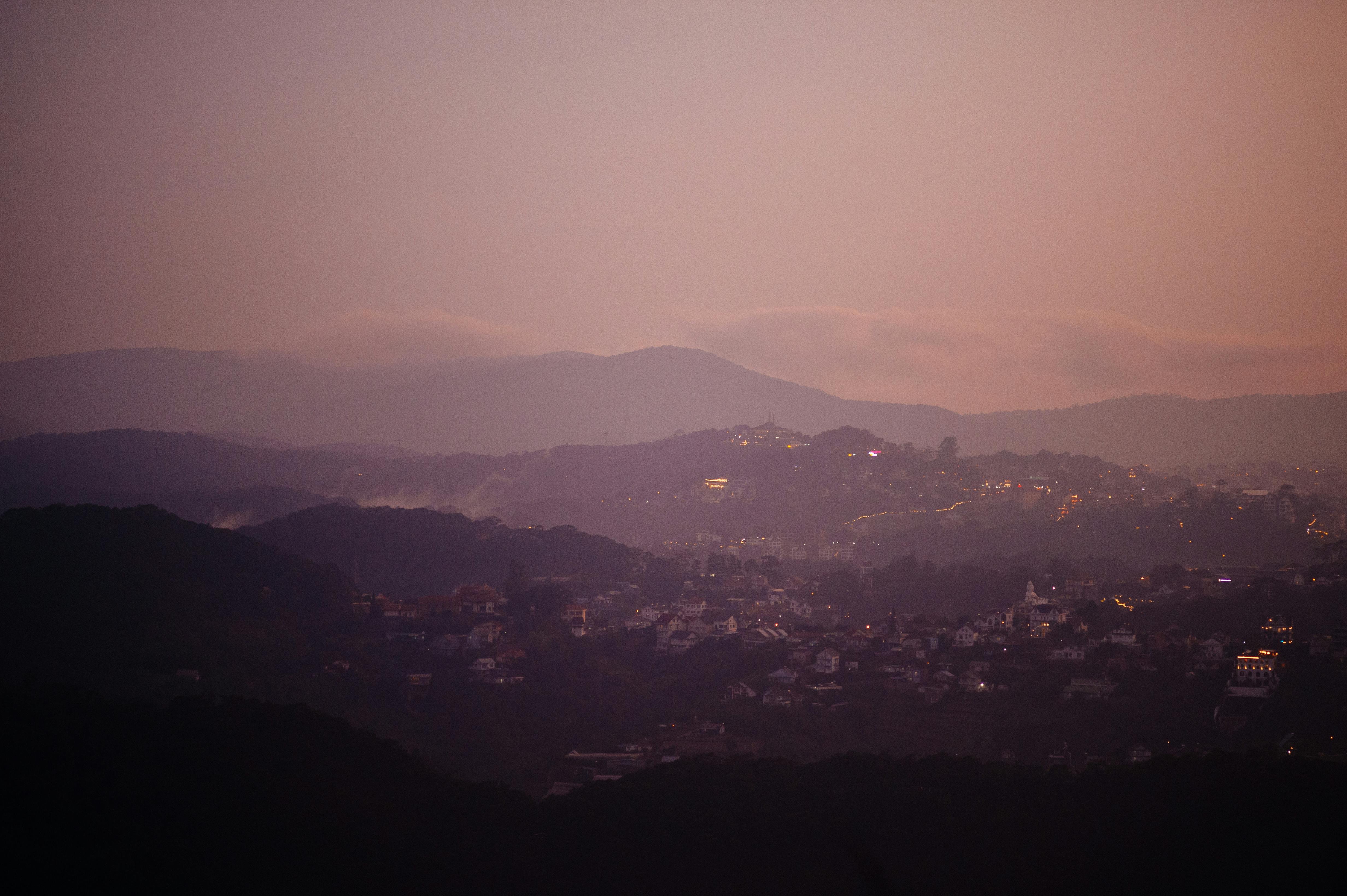 Tehran cityscape with mountains and dusk haze in the evening