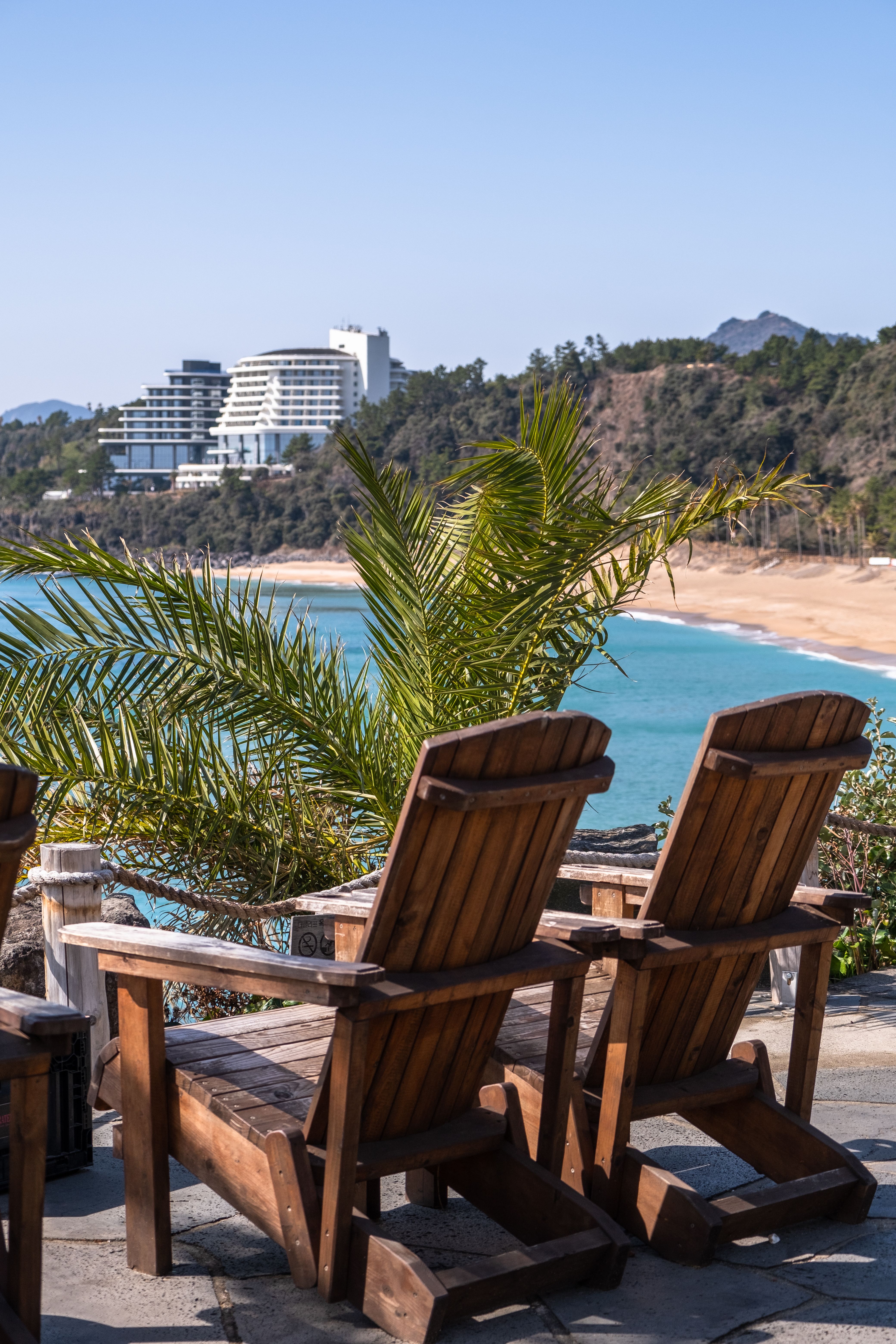 Wooden Deck Chairs on the Terrace by the Beach · Free Stock Photo