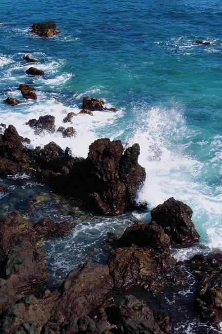 Capture of waves crashing on rocky coastline in Puerto de la Cruz, Spain.