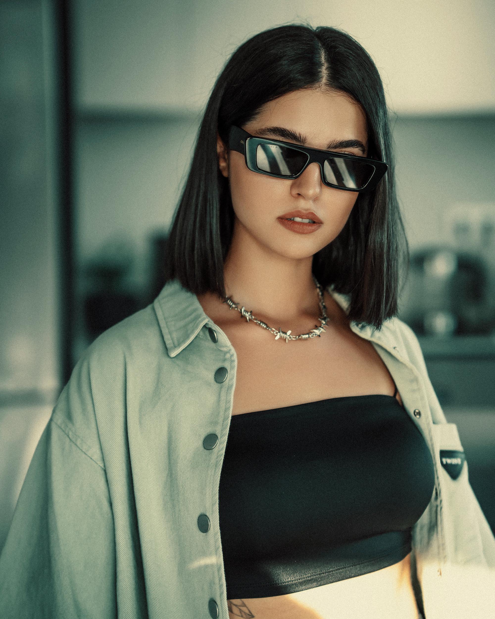 young fashionable woman in sunglasses