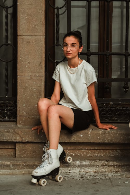 Young Brunette Woman with Roller Skates