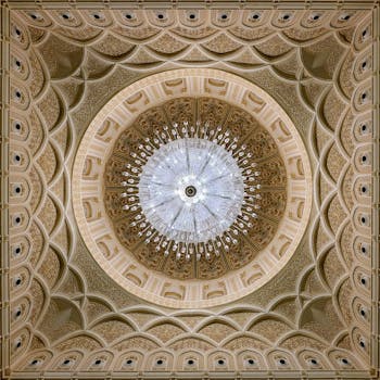 Stunning ornate dome with grand chandelier at Sultan Qaboos Grand Mosque, Salalah.