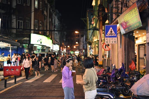People on Street in City at Night