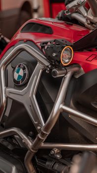 Detailed view of a motorbike's fuel tank and frame, showcasing design elements.