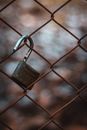 Close-Up Photo Of Padlock Hanging On Chain-link Fence