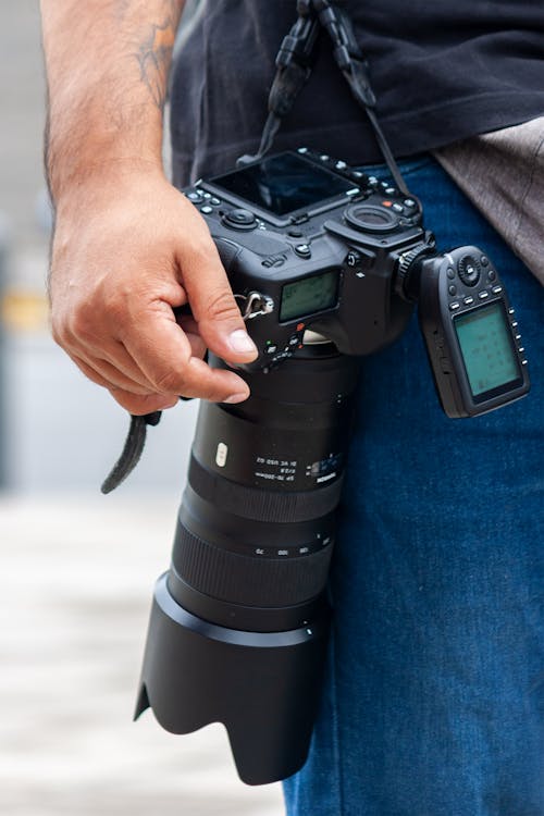 Man Carrying Camera