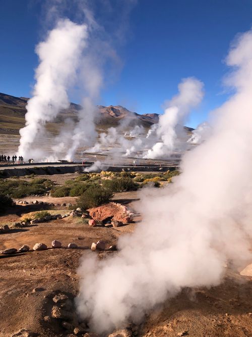 Free Explore the mesmerizing steam plumes of El Tatio Geysers in Chile's Atacama Desert during a sunny day. Stock Photo