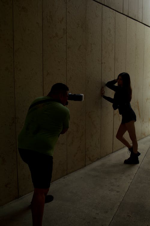 Photographer Taking Photos of a Model in a Tunnel