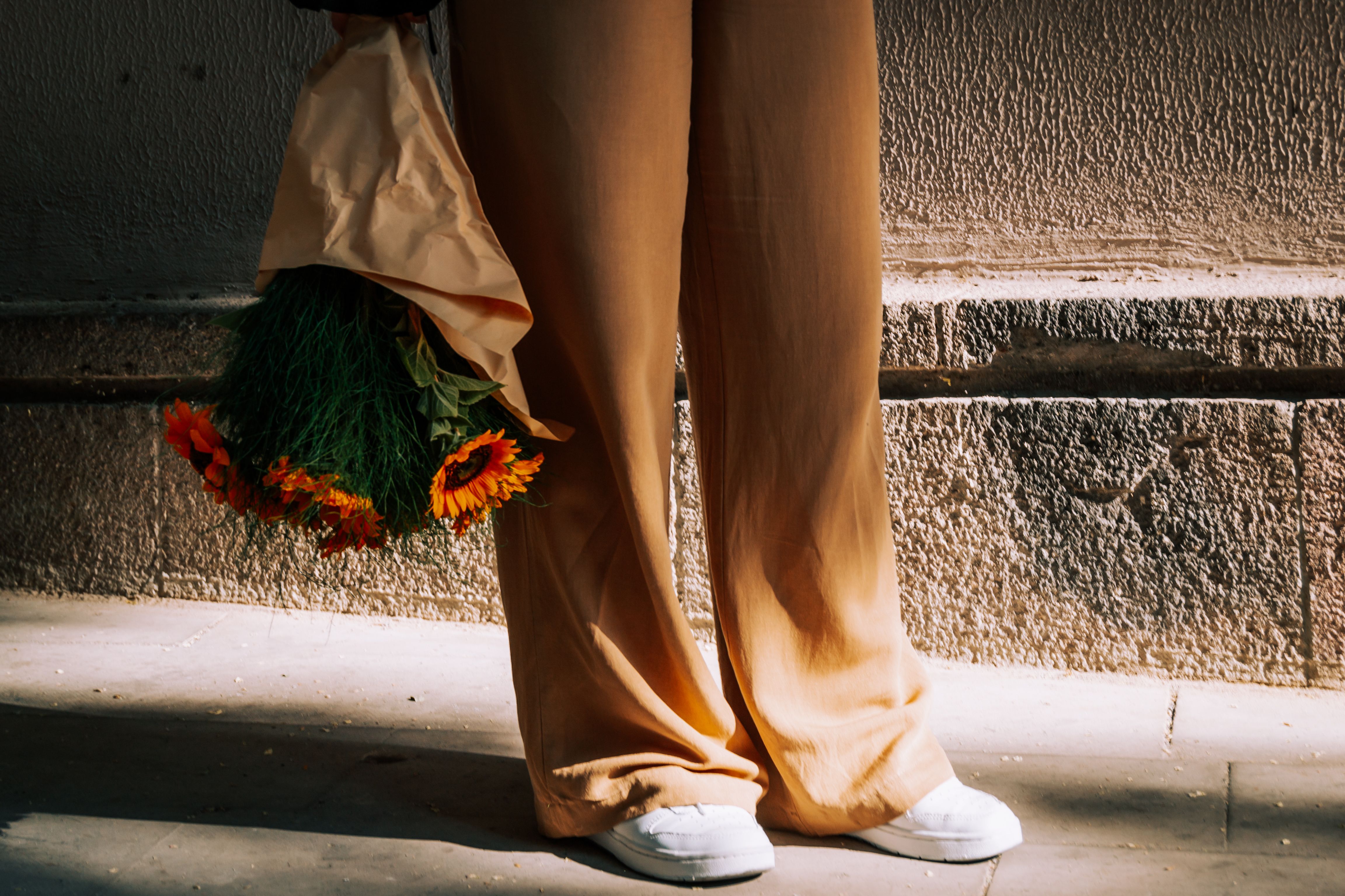 Balloon pants styled with a cropped top and flat sandals