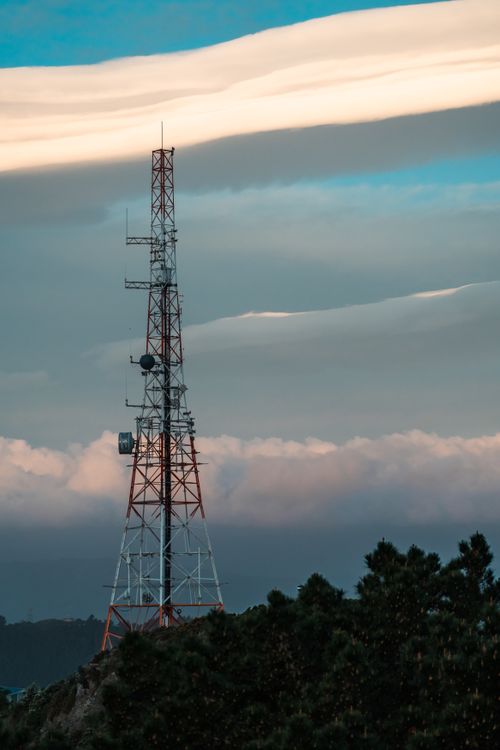 Free A towering metal structure stands against a cloudy sky in Wellington, New Zealand, symbolizing modern communication. Stock Photo