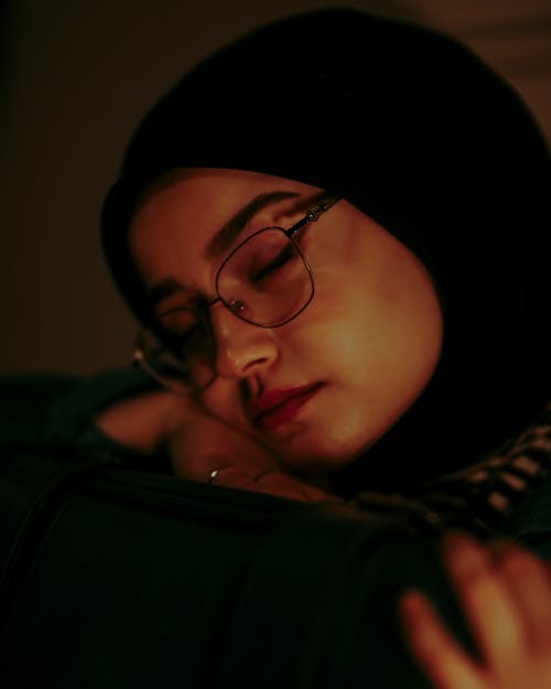 Photo of a Young Woman Wearing a Hijab and Eyeglasses 