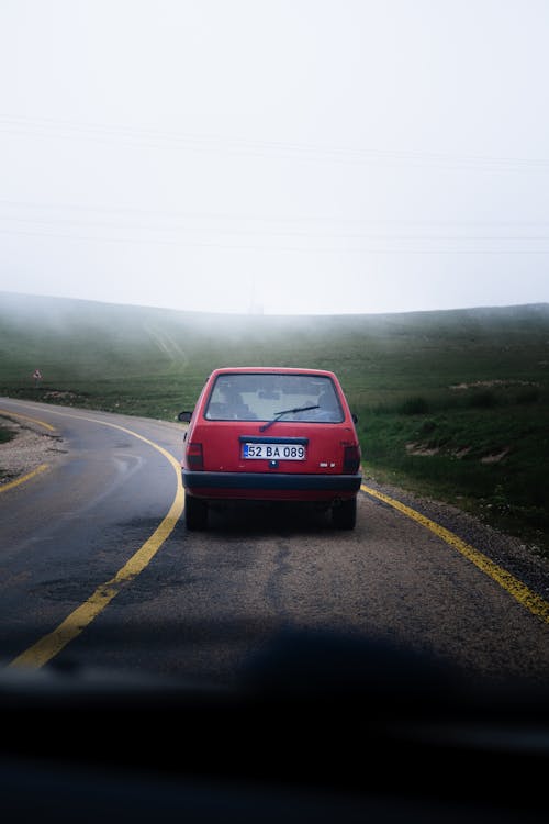 Old Car on a Rural Asphalt Road